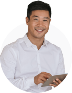 A professional looking man smiling at the camera with a tablet in his hands.